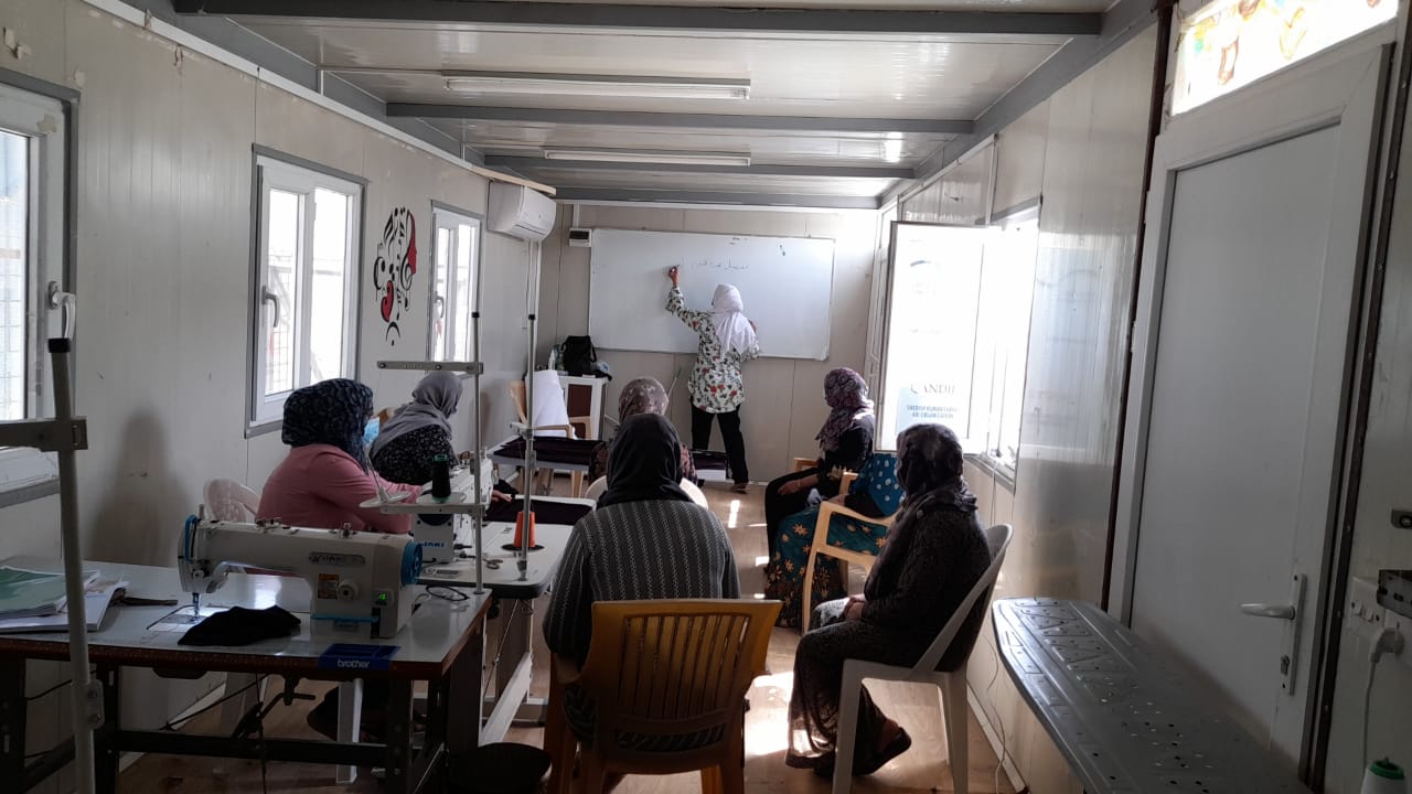 Women in a training facility at the Basirma refugee camp