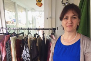 IMG_2468 Credit KosovaLive360_blog tile.jpg woman pictured in front of clothes