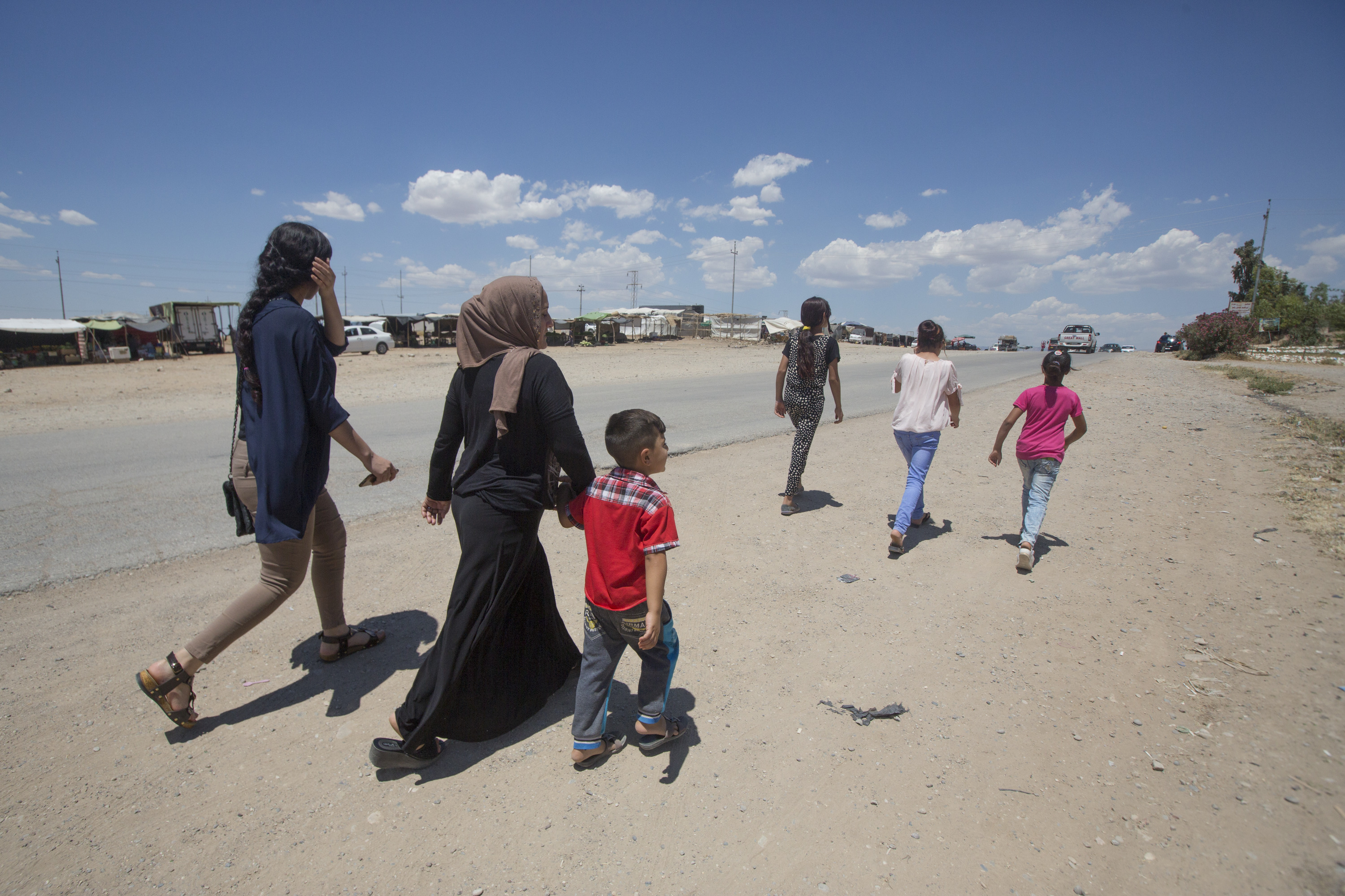 Displaced Yezidi woman, Seve, and her family. Photo credit: Alison Baskerville