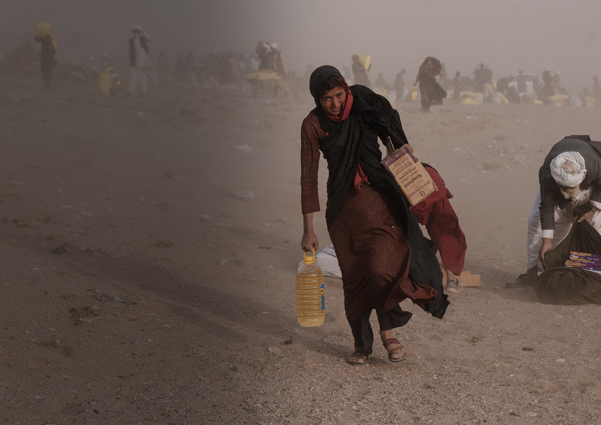 Afghan woman in dust storm in Herat