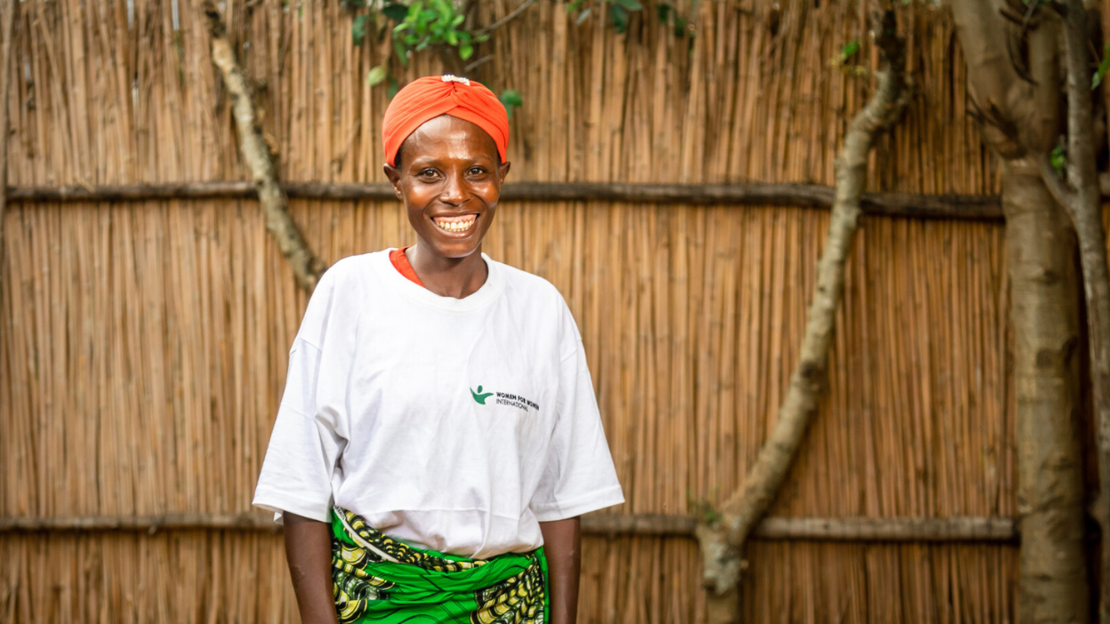 SWSN participant smiling in front of their home